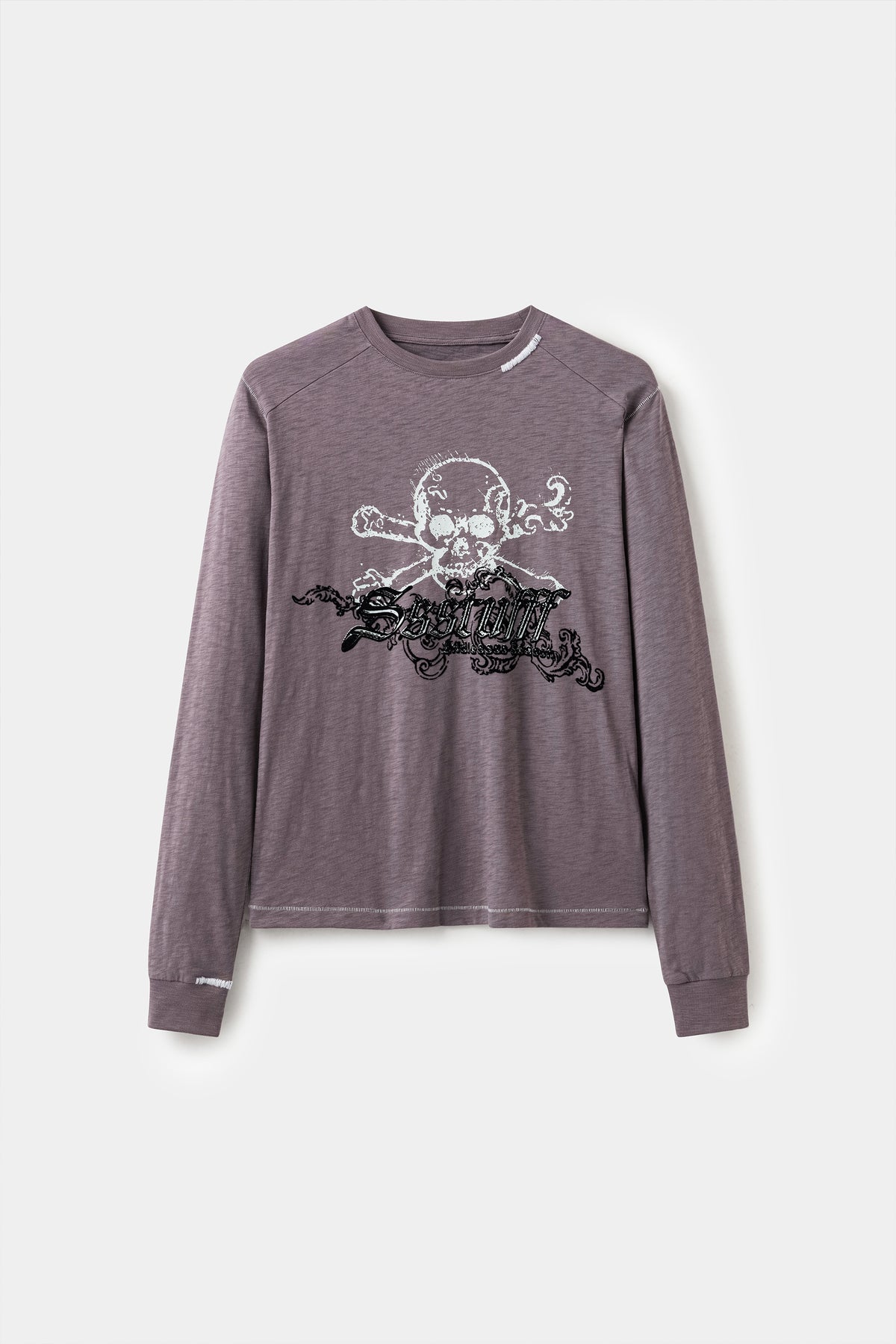 Front view of the purple Slub Flock Skull L/S Tee, with the skull graphic and raised black flock gothic lettering across the chest.