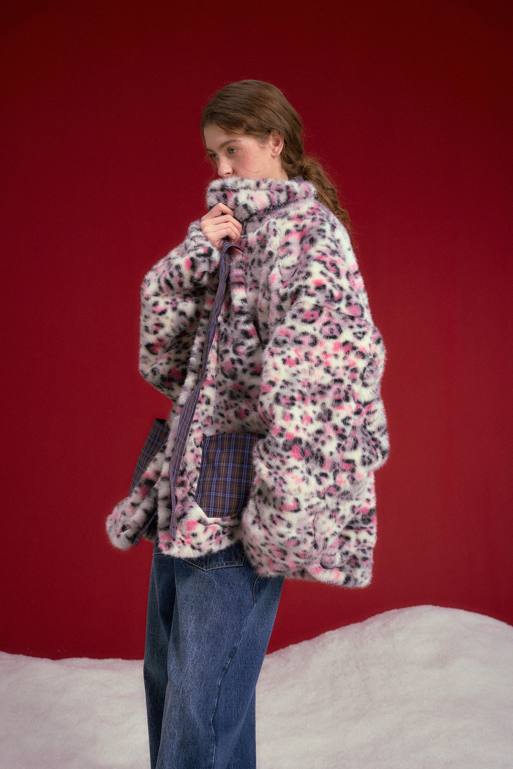 Reversible Leopard Print Checkered Coat worn on a female model, leopard faux fur side out, waist-up side view.