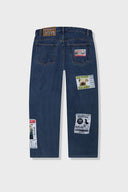 Medium blue relaxed fit jeans with embroidered and printed patches and white lace waist tie
