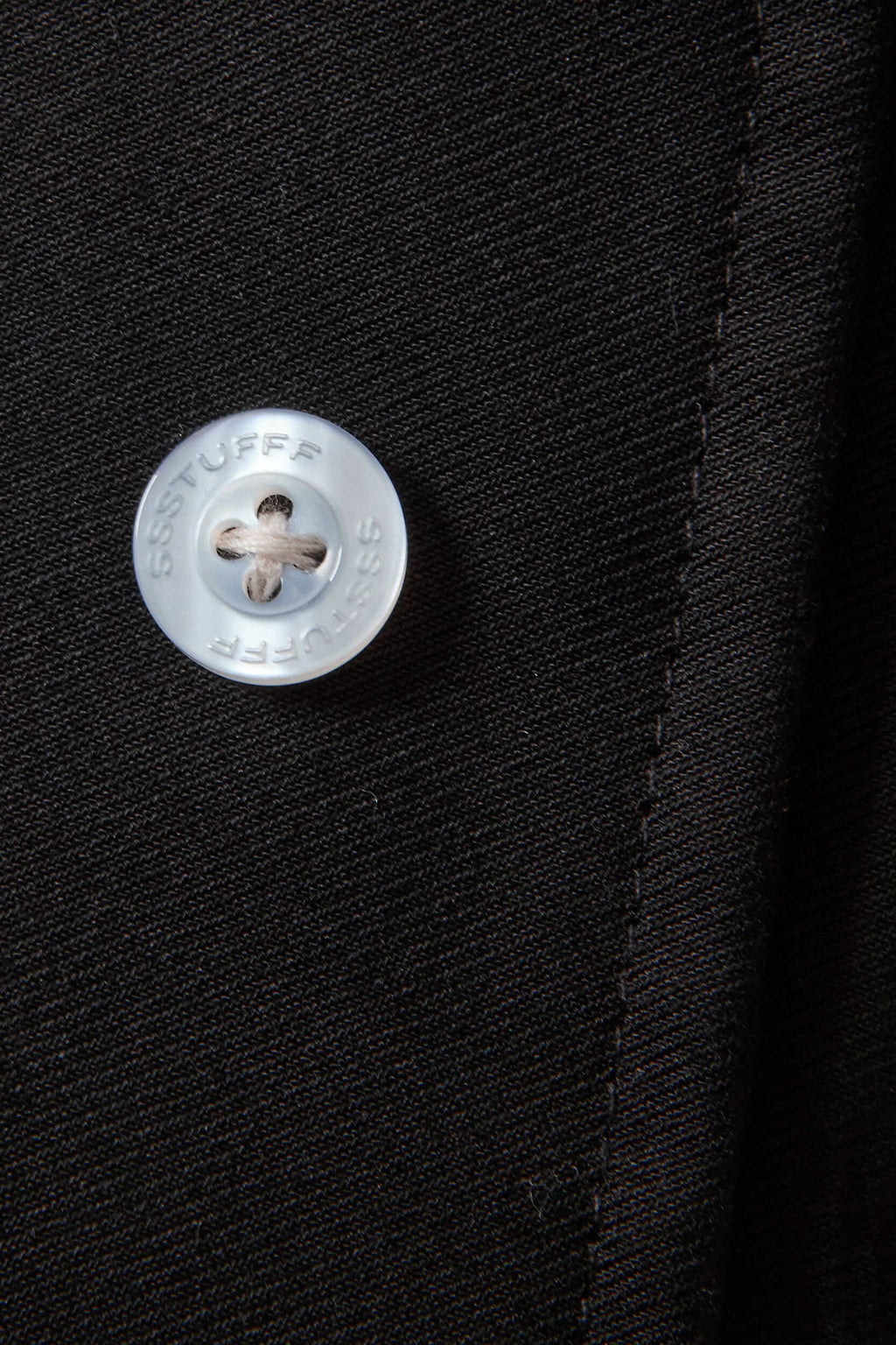 Black cotton twill trousers with tailored straight fit and SSSTUFFF button detailing on legs