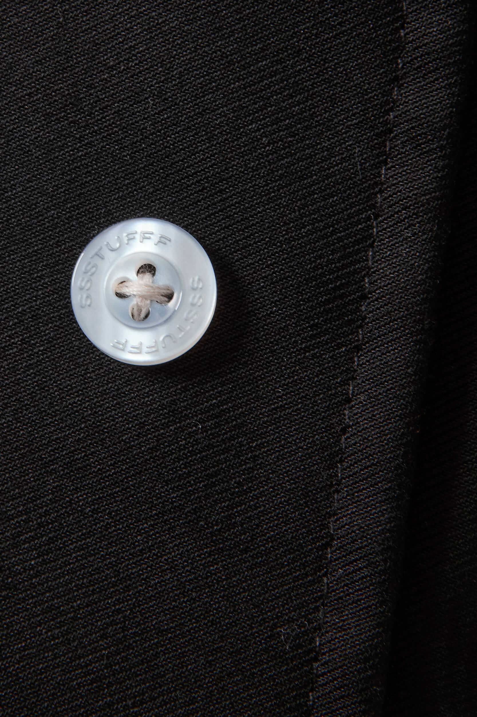 Black cotton twill trousers with tailored straight fit and SSSTUFFF button detailing on legs