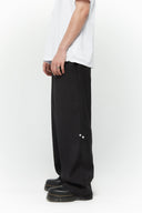 Black cotton twill trousers with tailored straight fit and SSSTUFFF button detailing on legs