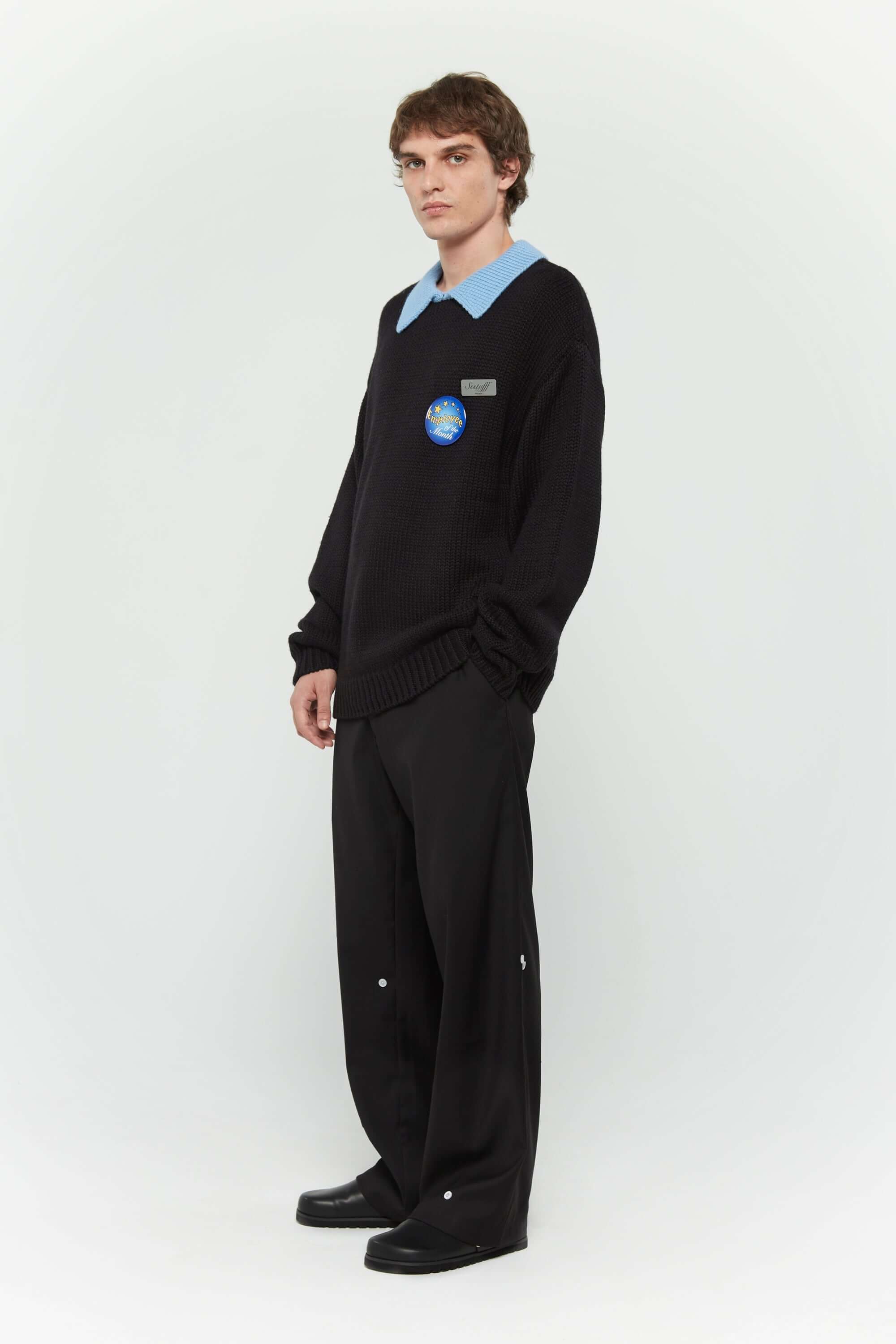Black cotton twill trousers with tailored straight fit and SSSTUFFF button detailing on legs