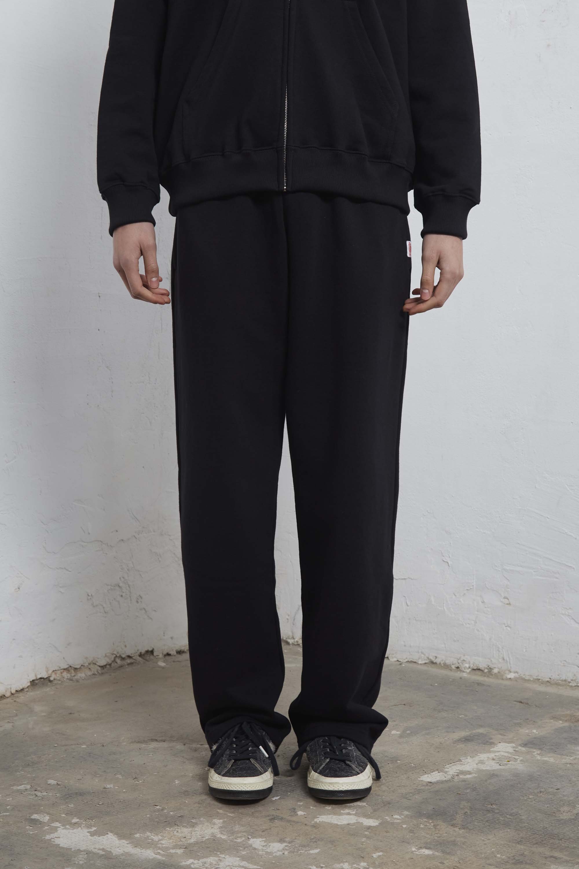 Black sweatpants with mini logo detail and drawstring waist