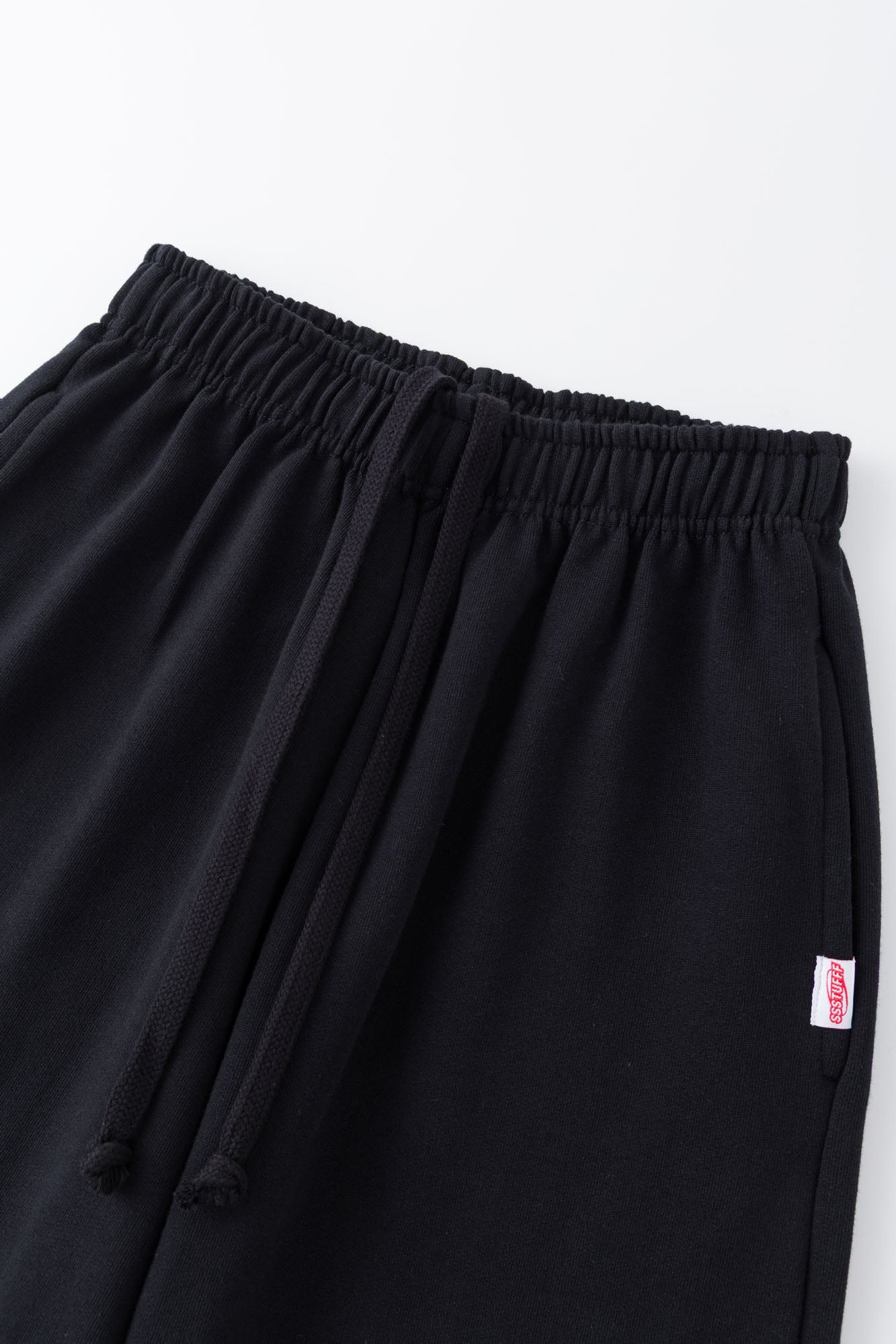 Black sweatpants with mini logo detail and drawstring waist