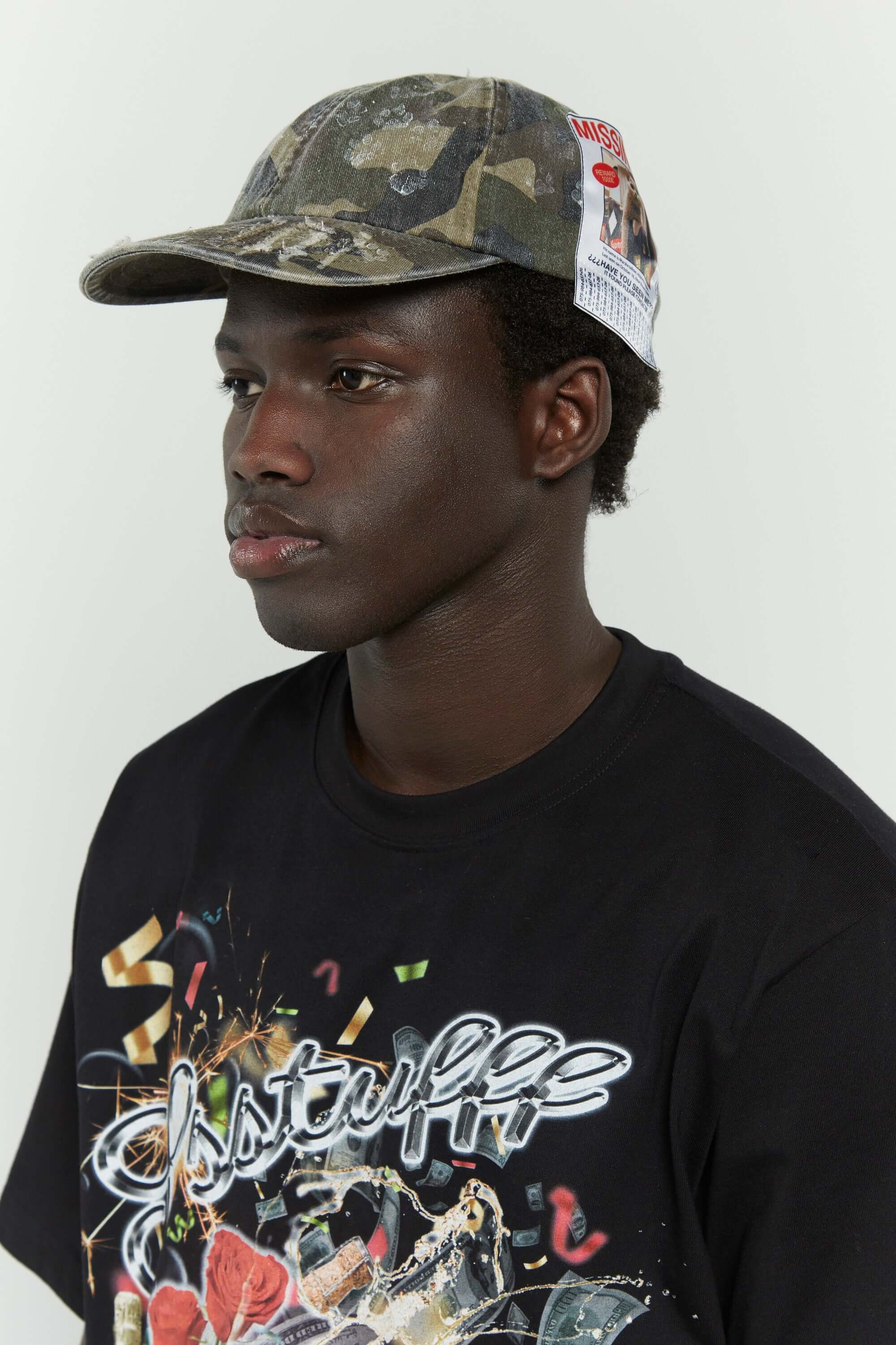 Camo cotton cap with missing cat jacquard patch and handcrafted cat scratches and footprints