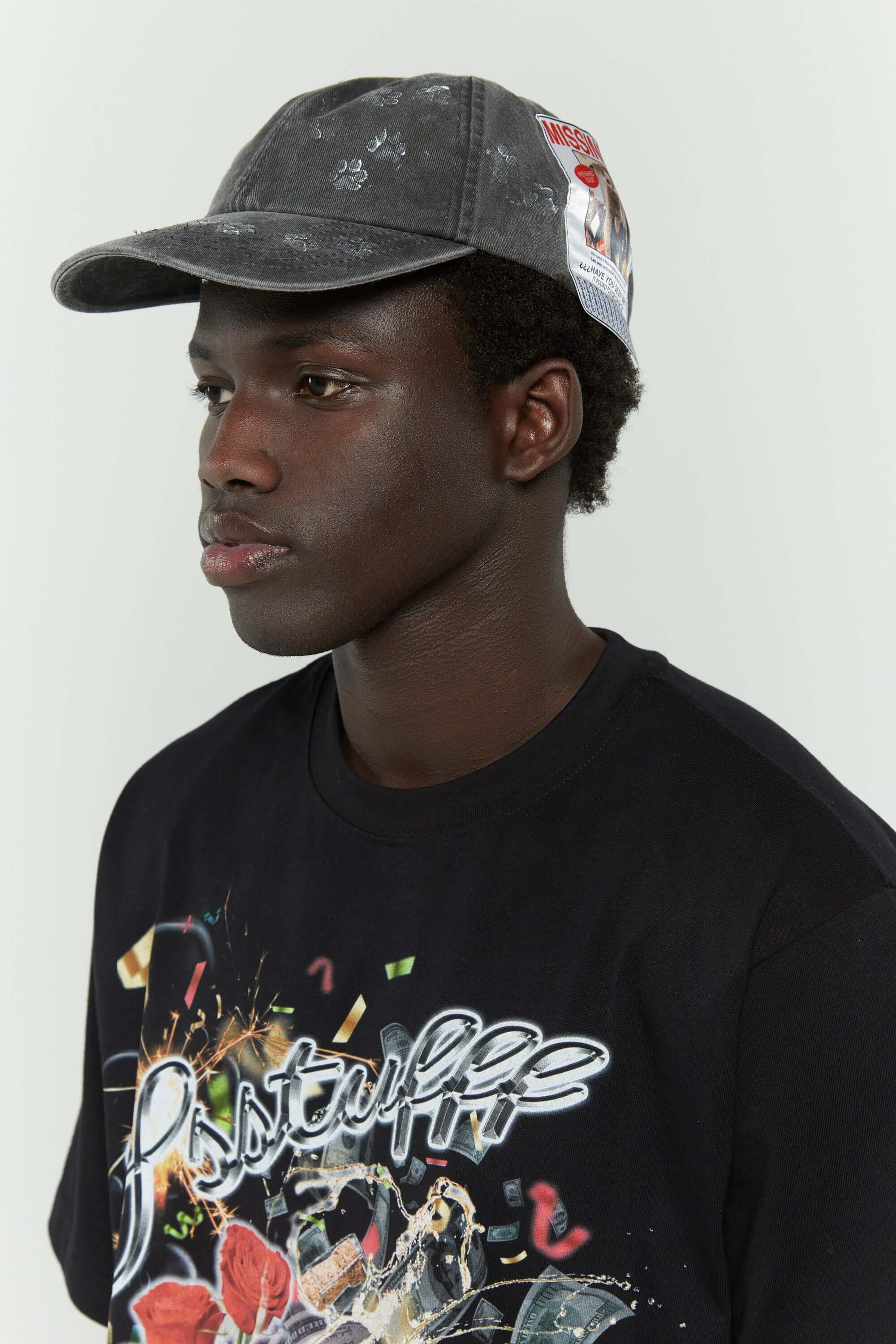 Dark grey cotton cap with missing cat jacquard patch and handcrafted cat scratches and footprints