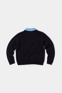 Black knit sweater designed to look like a shirt, with blue collar and attachable name tag and employee of the month pin