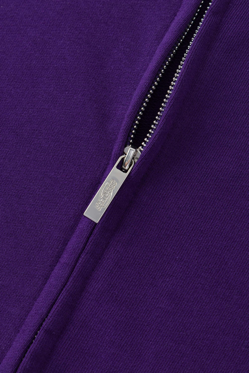 Purple zip-up hoodie with embroidered mini logo on the back