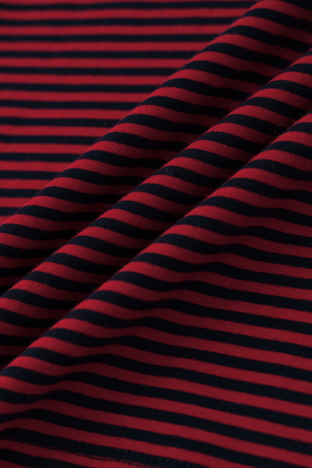 Red and black striped long-sleeve shirt with skull graphic and collage letter logo screenprint
