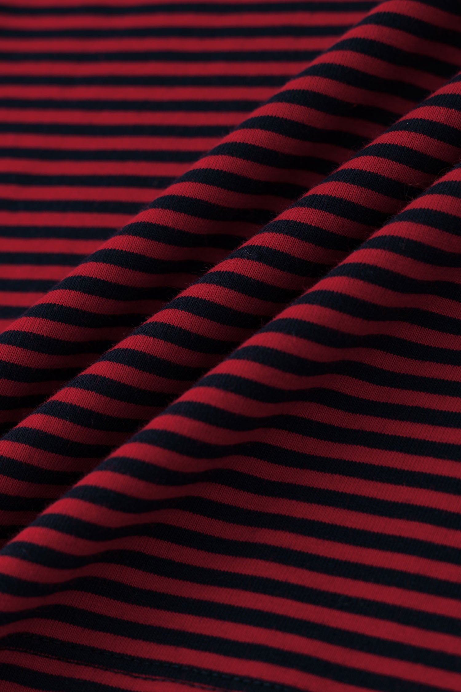 Red and black striped long-sleeve shirt with skull graphic and collage letter logo screenprint
