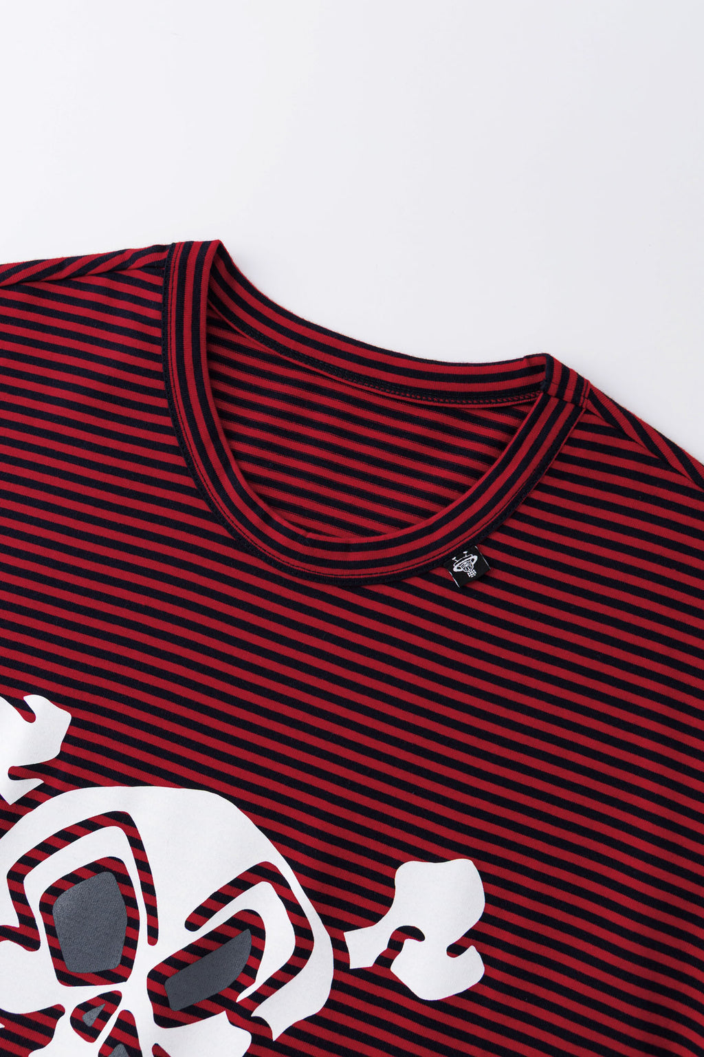 Red and black striped long-sleeve shirt with skull graphic and collage letter logo screenprint