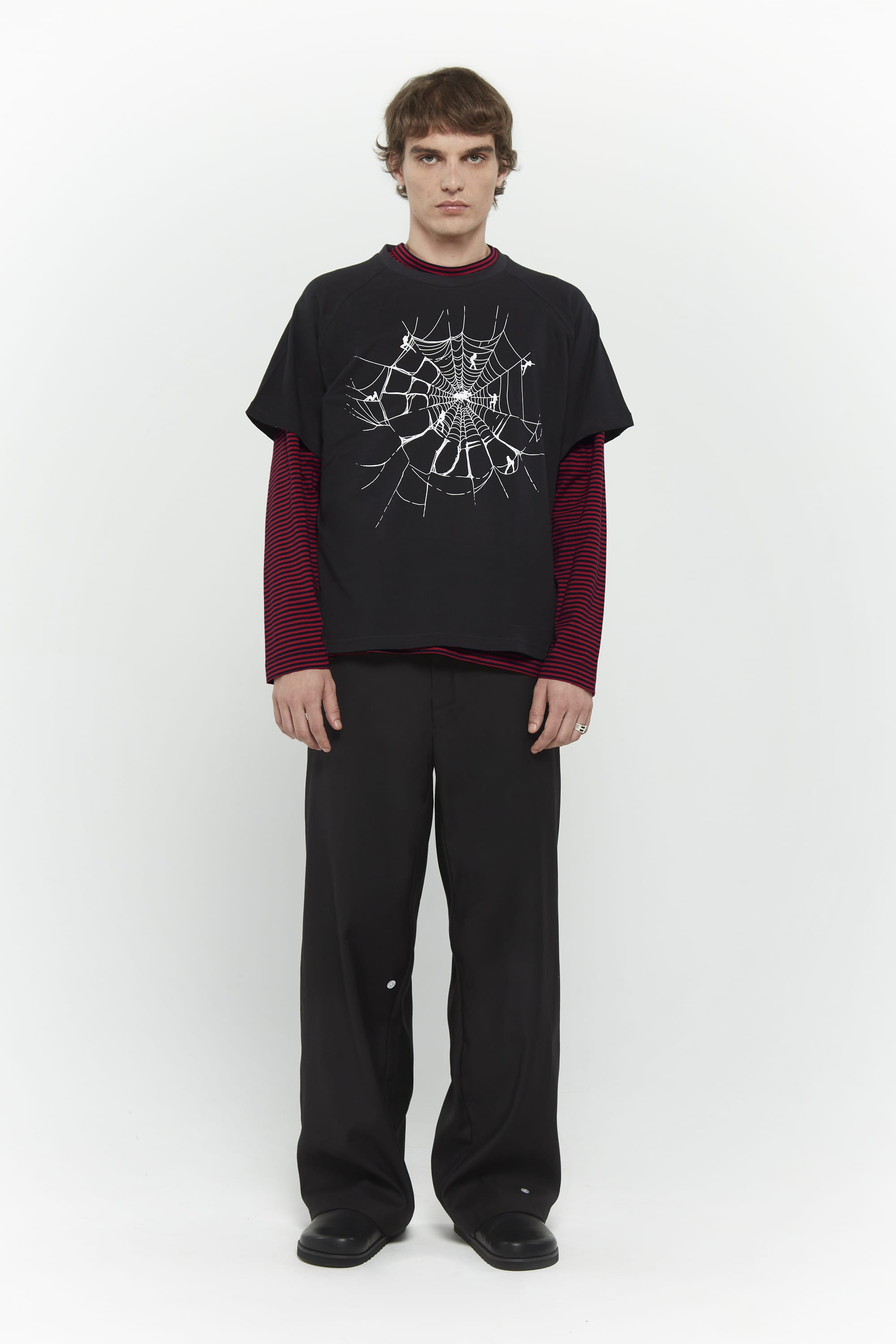 Layered red and black striped long-sleeve shirt with skull graphic and collage letter logo screenprint
