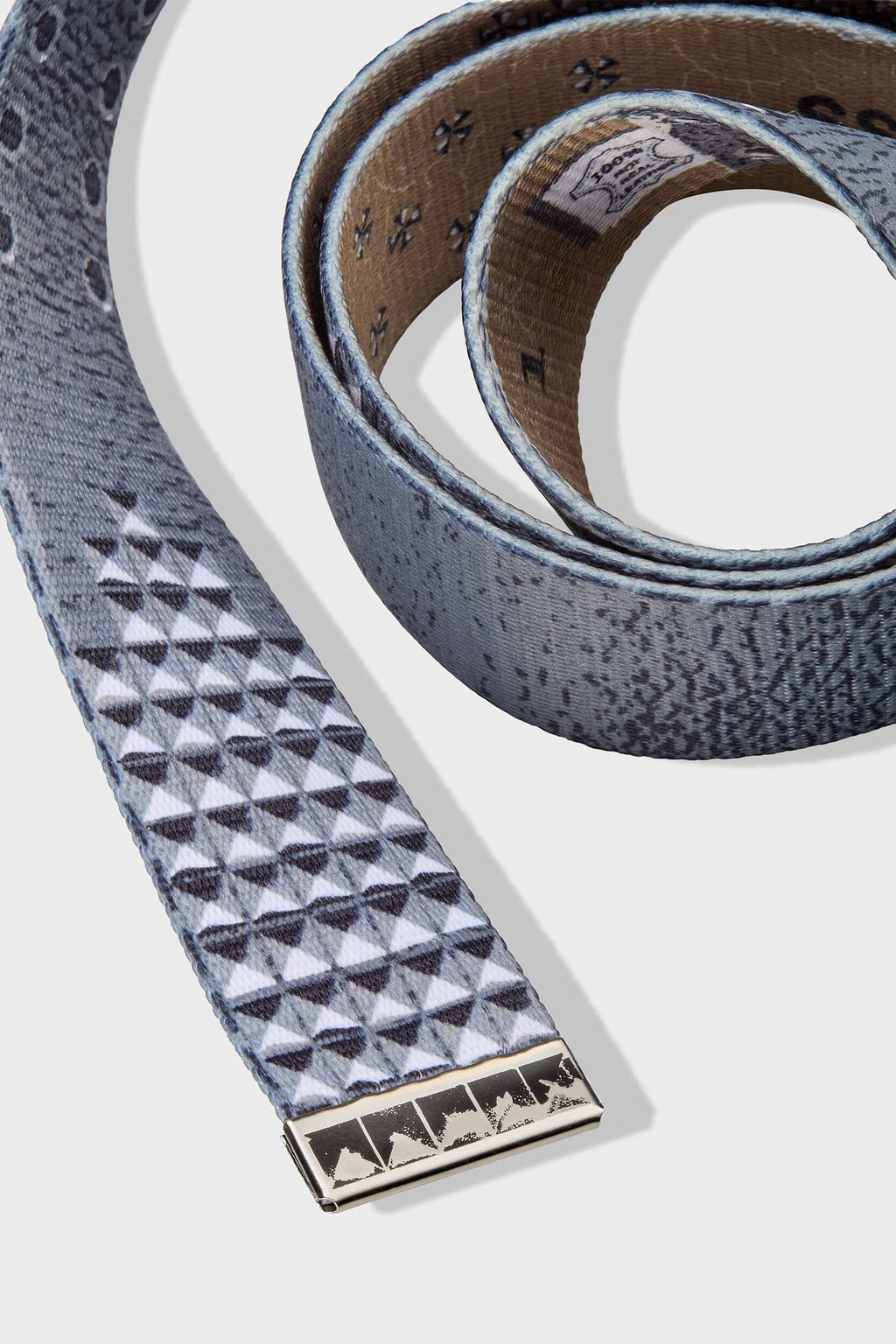 Canvas belt with printed rivets, metallic detailing, and SSSTUFFF engraved adjustable buckle