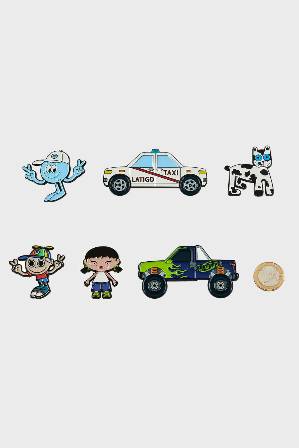 A pack of six metallic pins with a collaboration carton, featuring various designs including a blue creature, a white dog, two cartoon characters, and two vehicles.