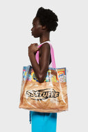 A multicolor grocery bag with 'SSSTUFF' printed on it and equipped with two strong cotton handles.