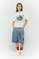 White t-shirt with various colorful fruits graphic, Barcelona text, and scented print that smells like sweet banana