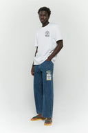 White t-shirt with UV reactive tiger graphic and 'Always Trippin' text that changes color in sunlight