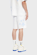 A pair of white shorts with blue striped stars and patchwork details.