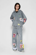 Oversized wide trousers with hand-sewn and applied vintage advertisement patches