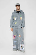 Oversized wide trousers with hand-sewn and applied vintage advertisement patches