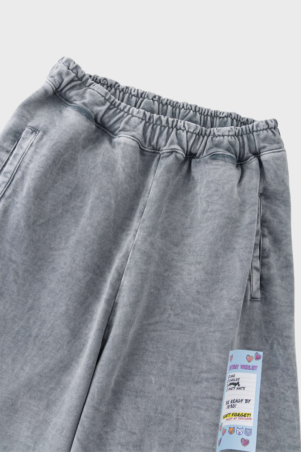 Oversized wide trousers with hand-sewn and applied vintage advertisement patches