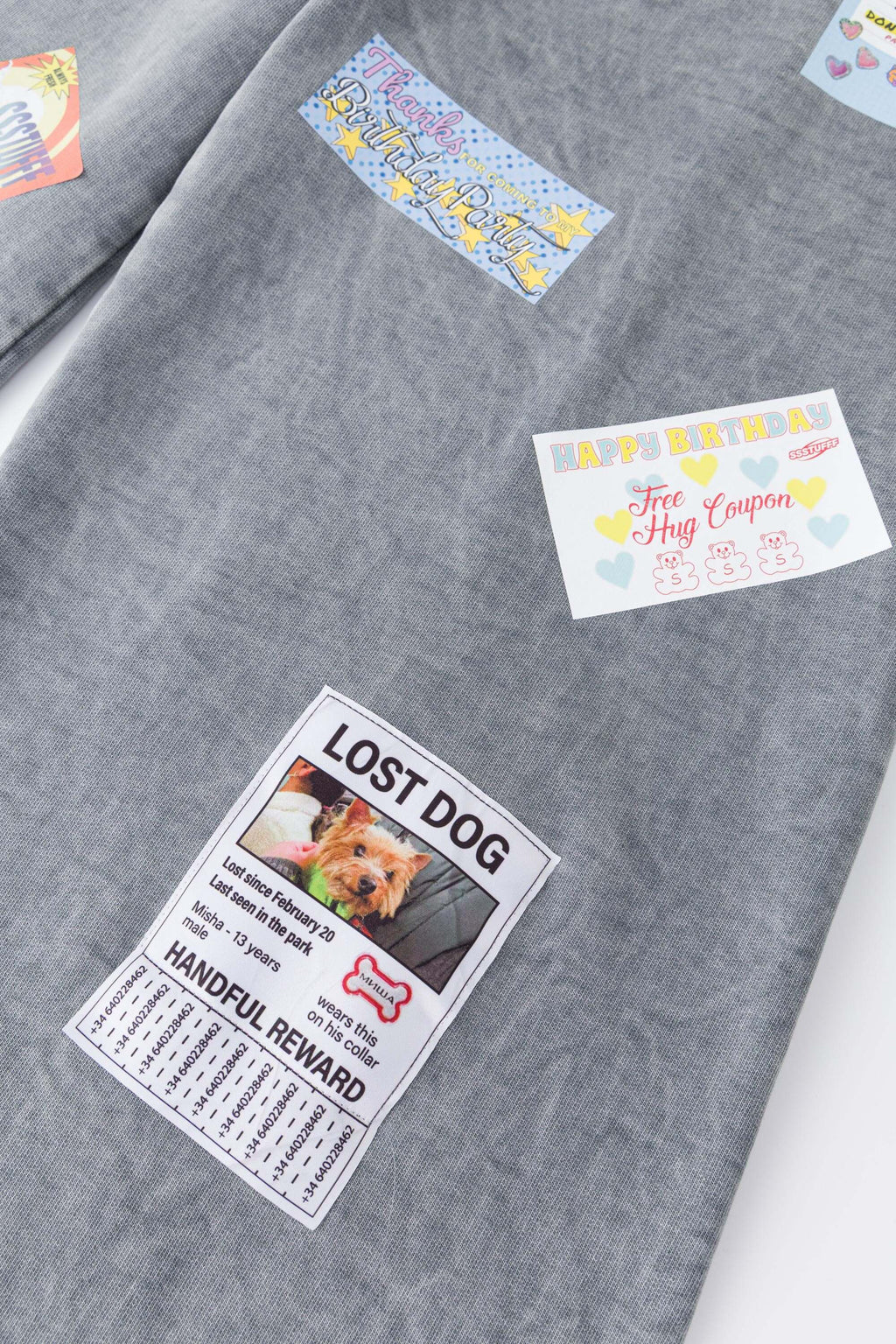 Oversized wide trousers with hand-sewn and applied vintage advertisement patches