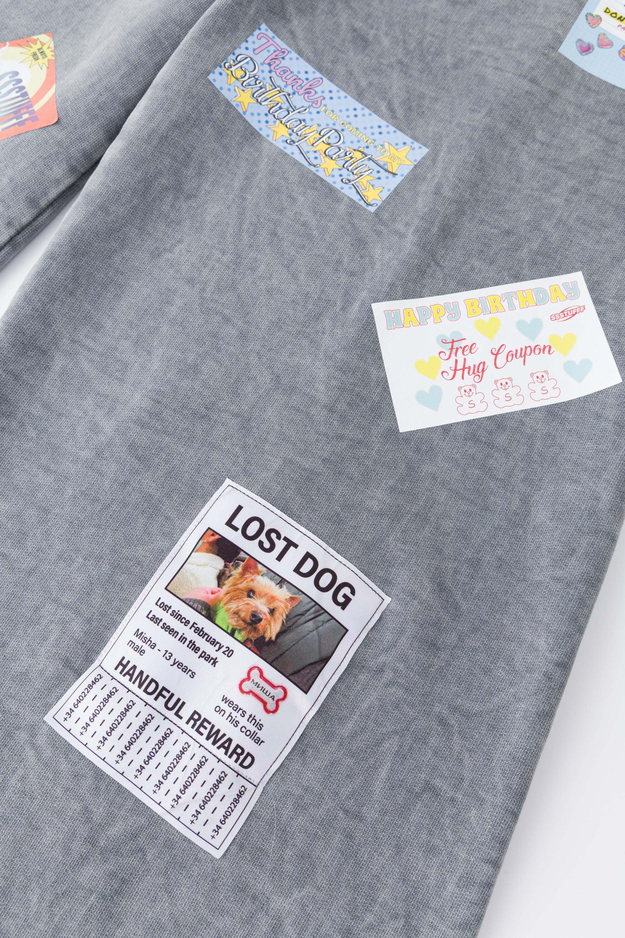 Oversized wide trousers with hand-sewn and applied vintage advertisement patches