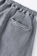 Oversized wide trousers with hand-sewn and applied vintage advertisement patches