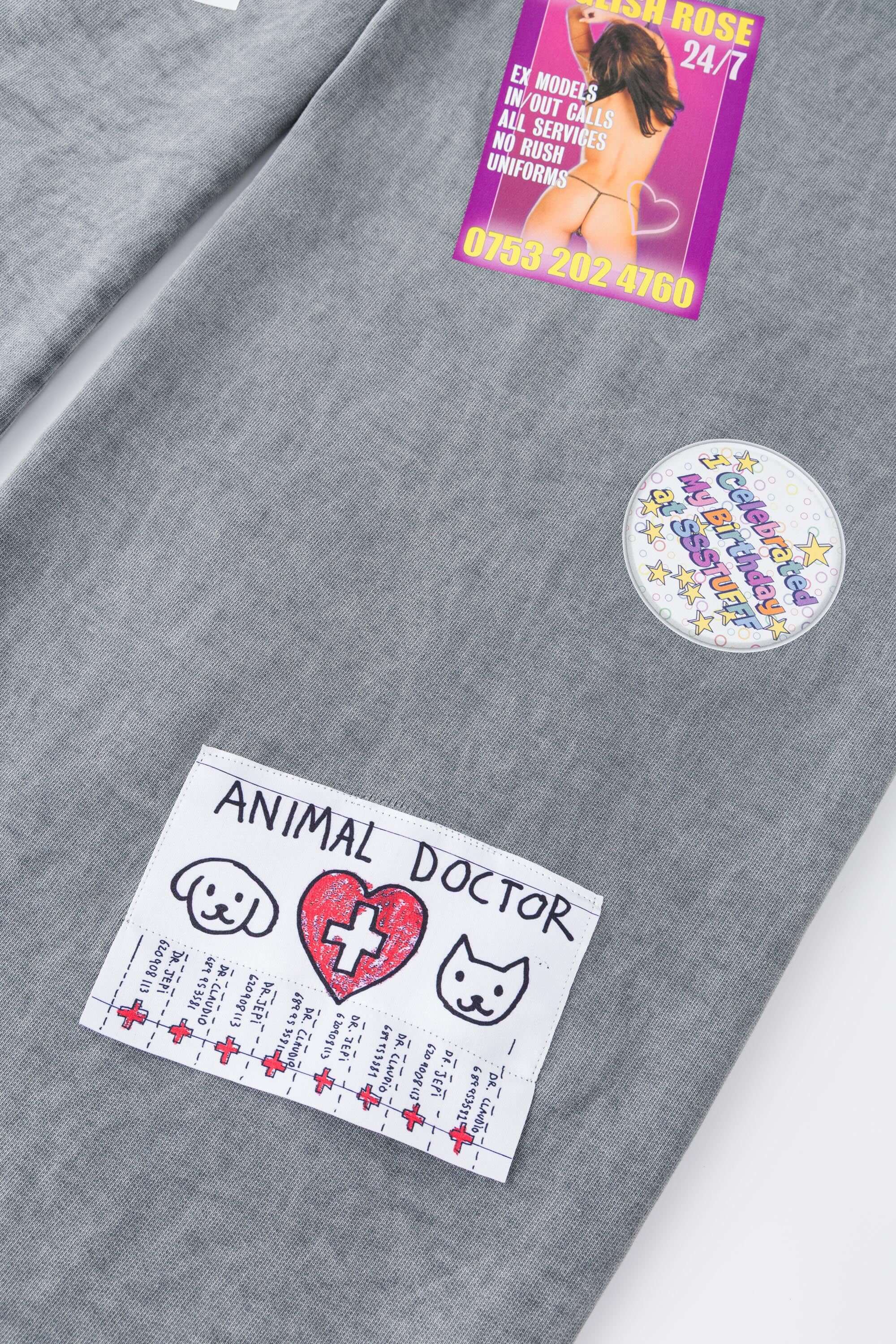 Oversized wide trousers with hand-sewn and applied vintage advertisement patches