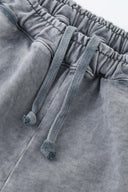 Oversized wide trousers with hand-sewn and applied vintage advertisement patches