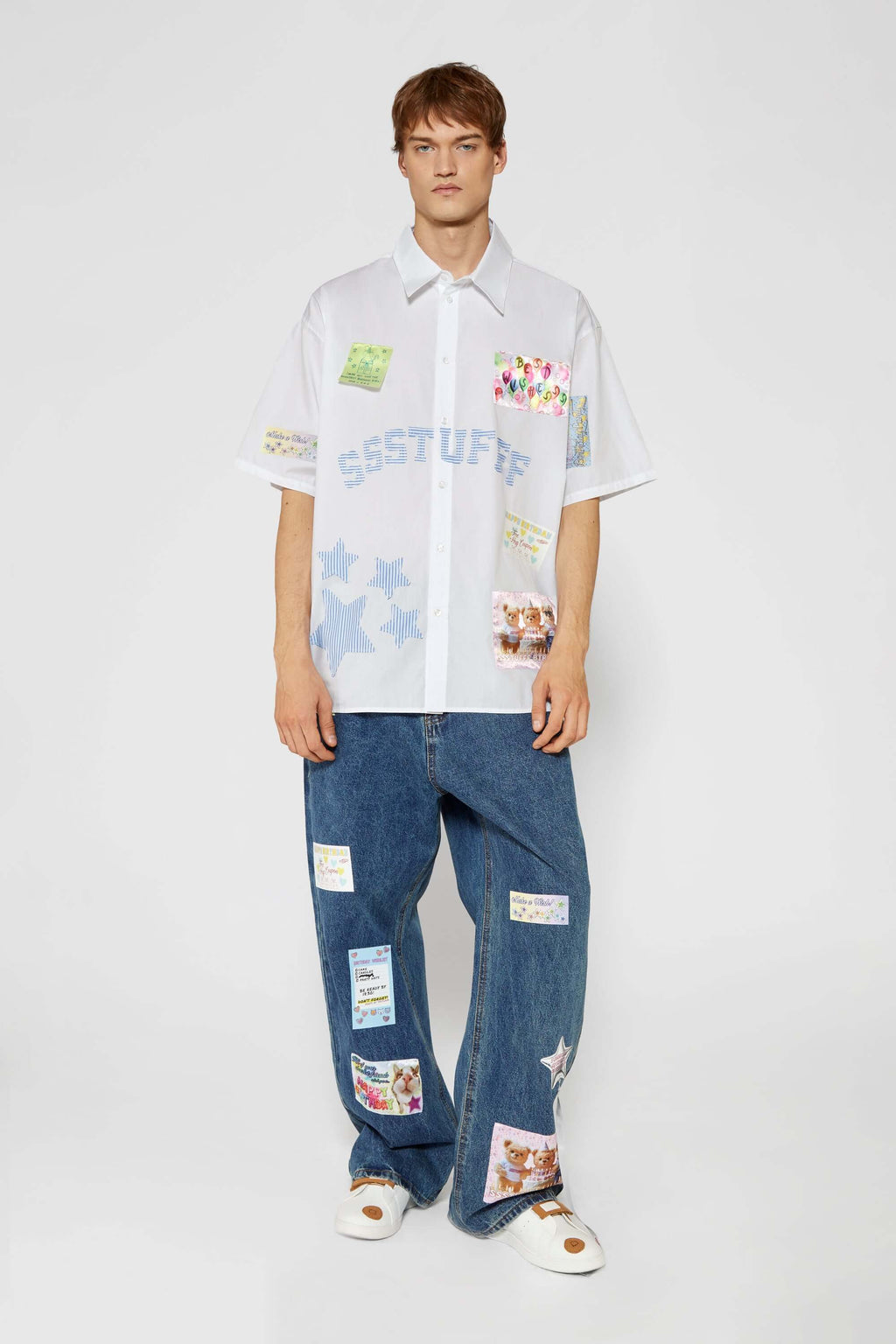 White shirt with jacquard, vinyl, and sublimated birthday postcard graphics inspired by greeting cards