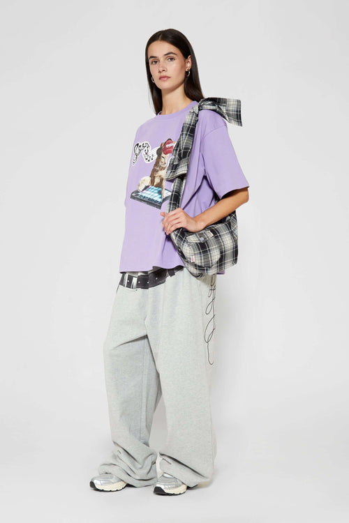 Black and white checked croissant-shaped mini bag with shirt texture and adjustable sleeve handles for shoulder or crossbody wear
