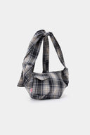 Black and white checked croissant-shaped mini bag with shirt texture and adjustable sleeve handles for shoulder or crossbody wear