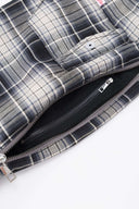 Black and white checked croissant-shaped mini bag with shirt texture and adjustable sleeve handles for shoulder or crossbody wear