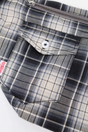 Black and white checked croissant-shaped mini bag with shirt texture and adjustable sleeve handles for shoulder or crossbody wear