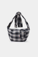 Black and white checked croissant-shaped bag with shirt texture and adjustable sleeve handles for shoulder or crossbody wear