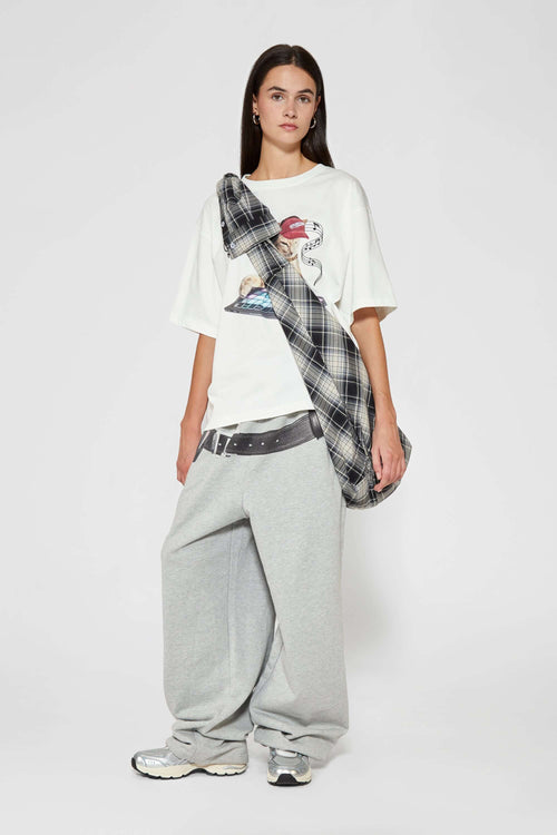 Black and white checked croissant-shaped bag with shirt texture and adjustable sleeve handles for shoulder or crossbody wear