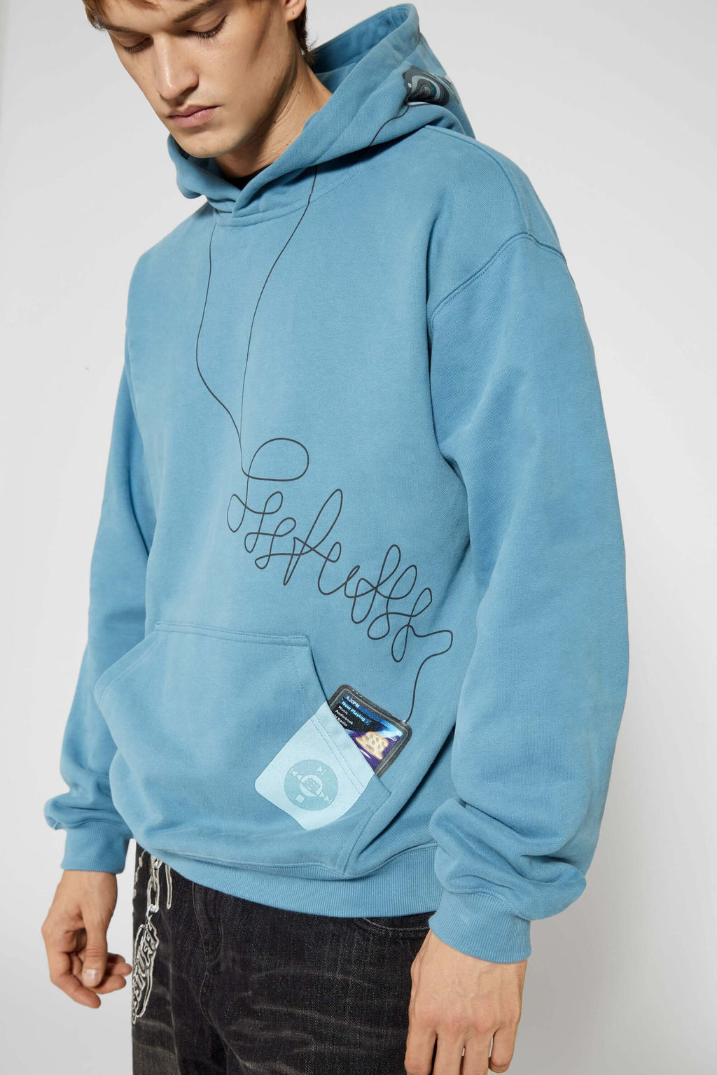 Blue hoodie with digital print of classic headphones and MP3 player extending from hood to front pocket