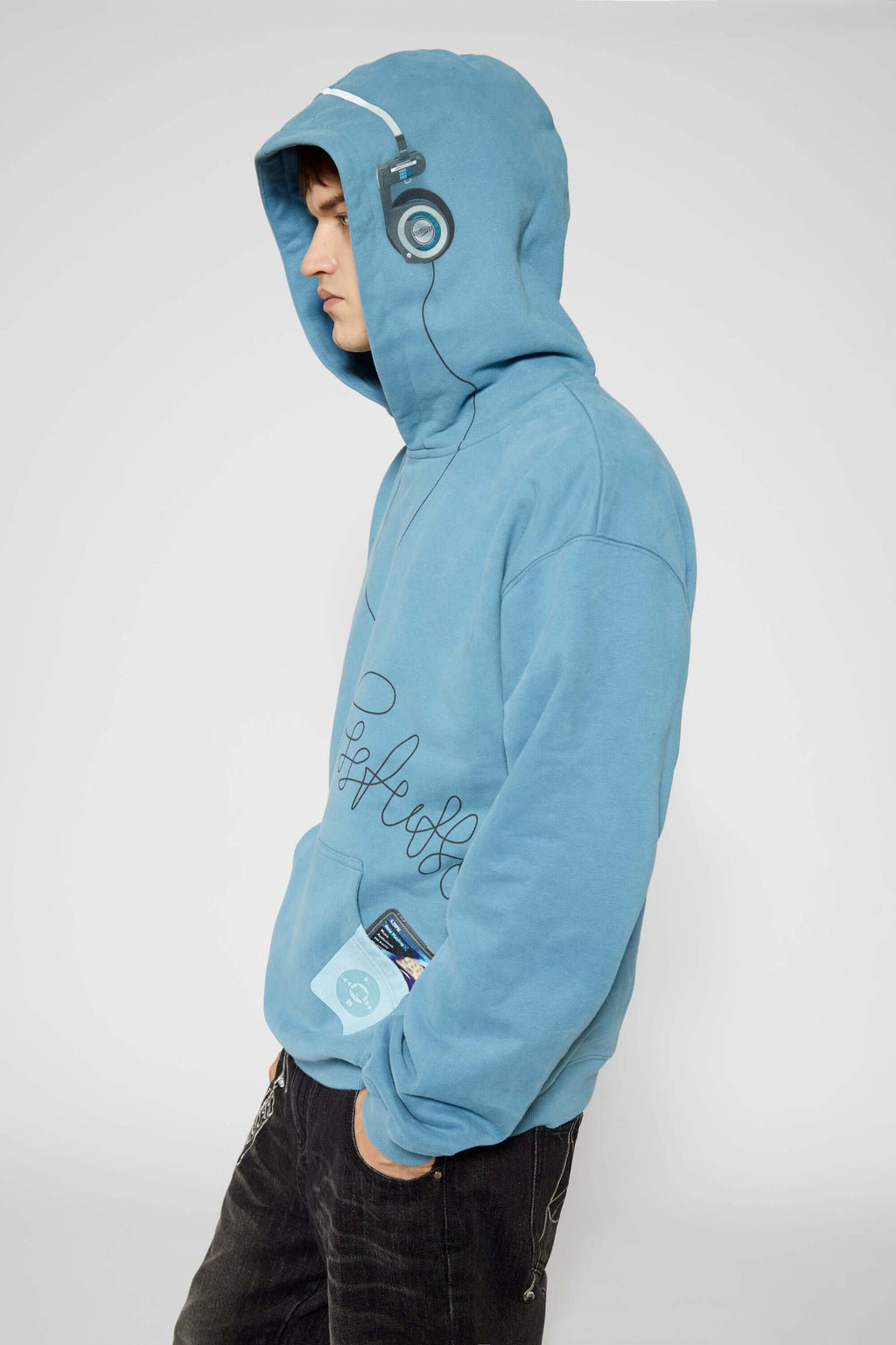 Blue hoodie with digital print of classic headphones and MP3 player extending from hood to front pocket