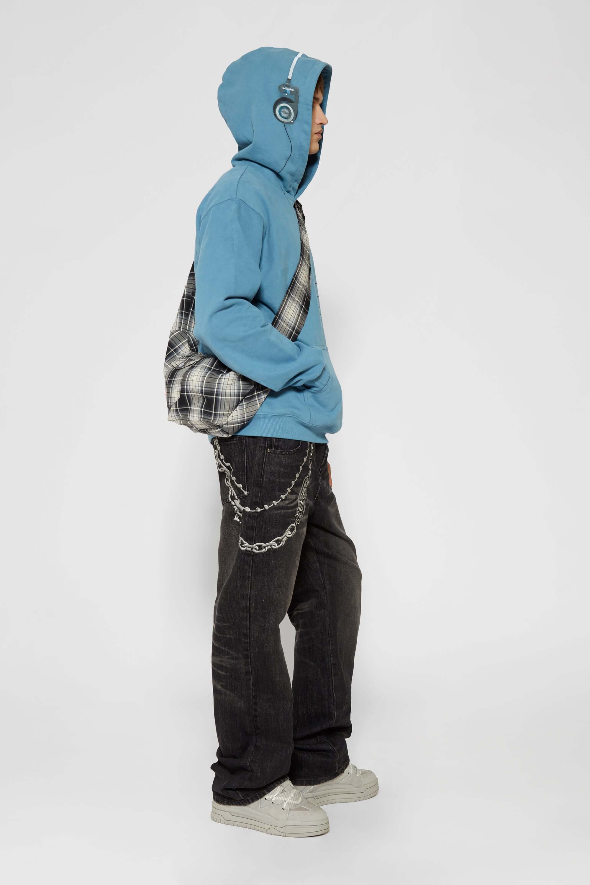 Blue hoodie with digital print of classic headphones and MP3 player extending from hood to front pocket