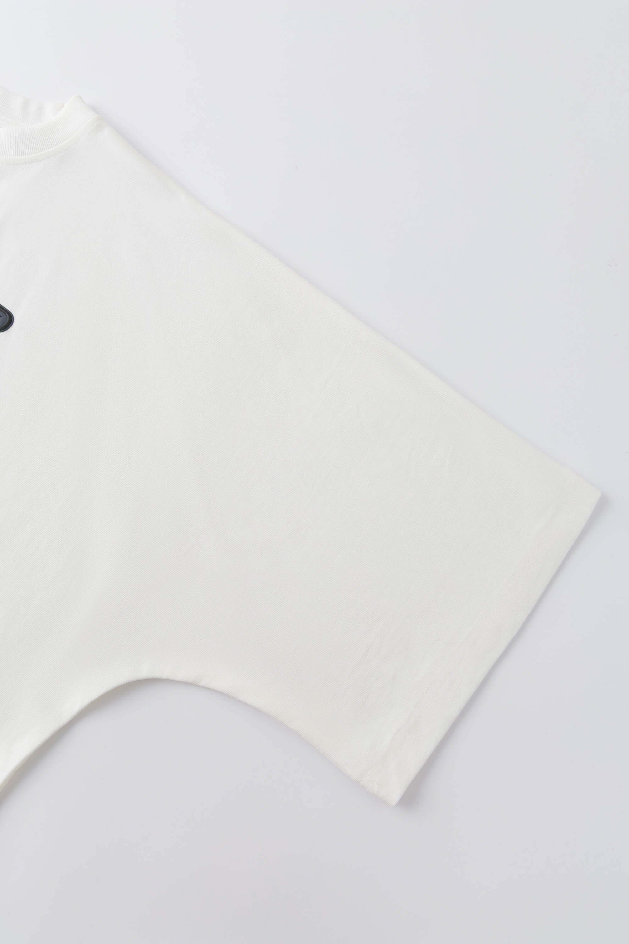 White oversized t-shirt with cyberpunk digital audio stereo interface print, TPU buttons, and holographic SSSTUFFF motif