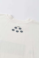 White oversized t-shirt with cyberpunk digital audio stereo interface print, TPU buttons, and holographic SSSTUFFF motif