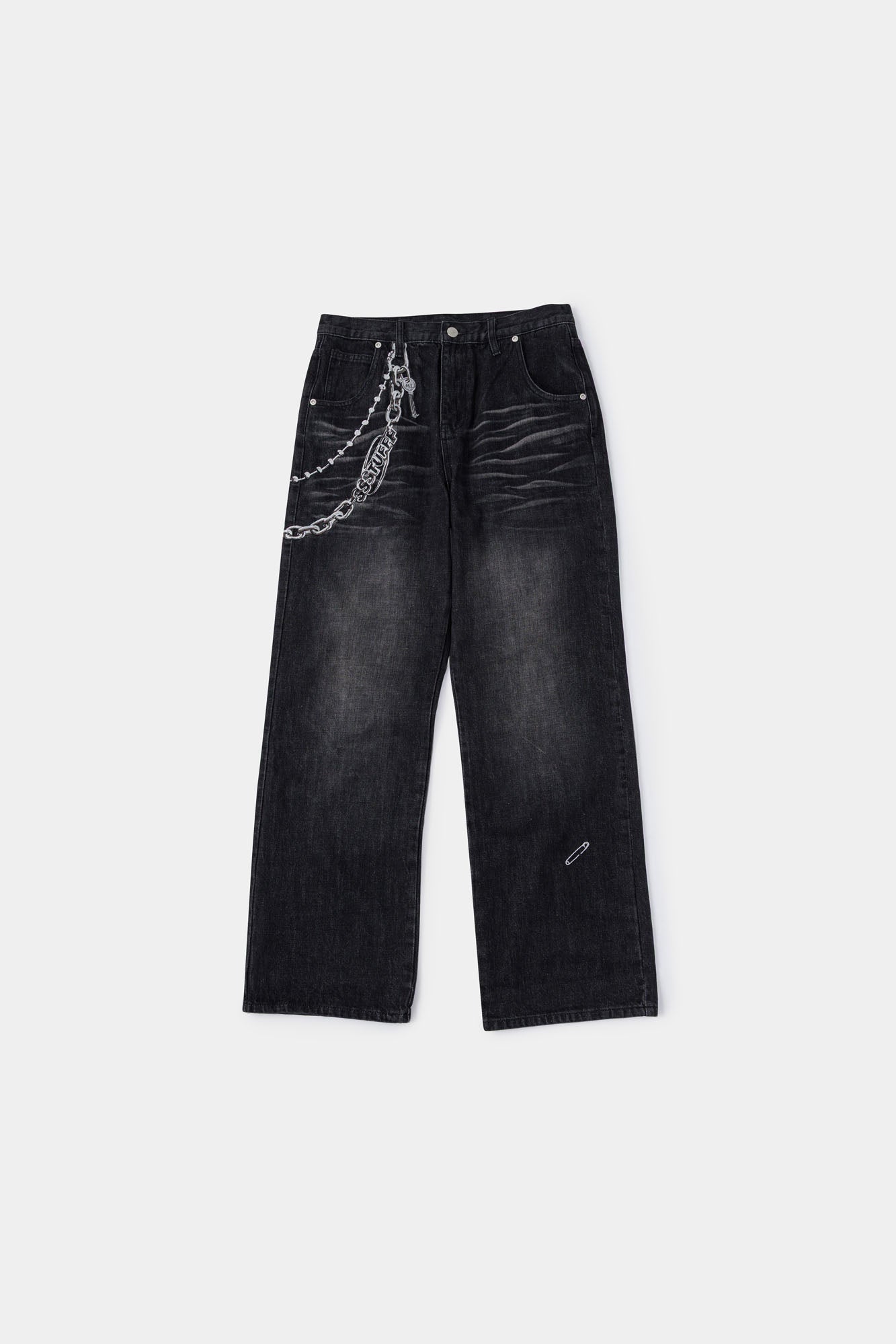Black wash denim jeans with embroidered keychain, carabiner, and earphone charm details, and pin embroidery on ankle