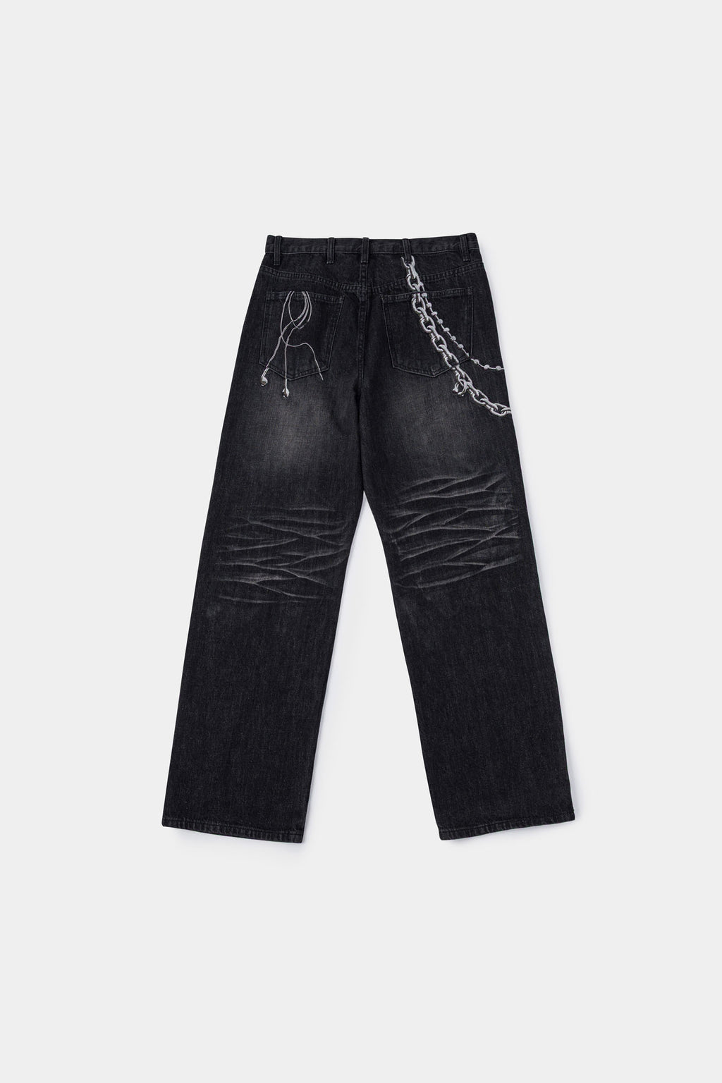Black wash denim jeans with embroidered keychain, carabiner, and earphone charm details, and pin embroidery on ankle