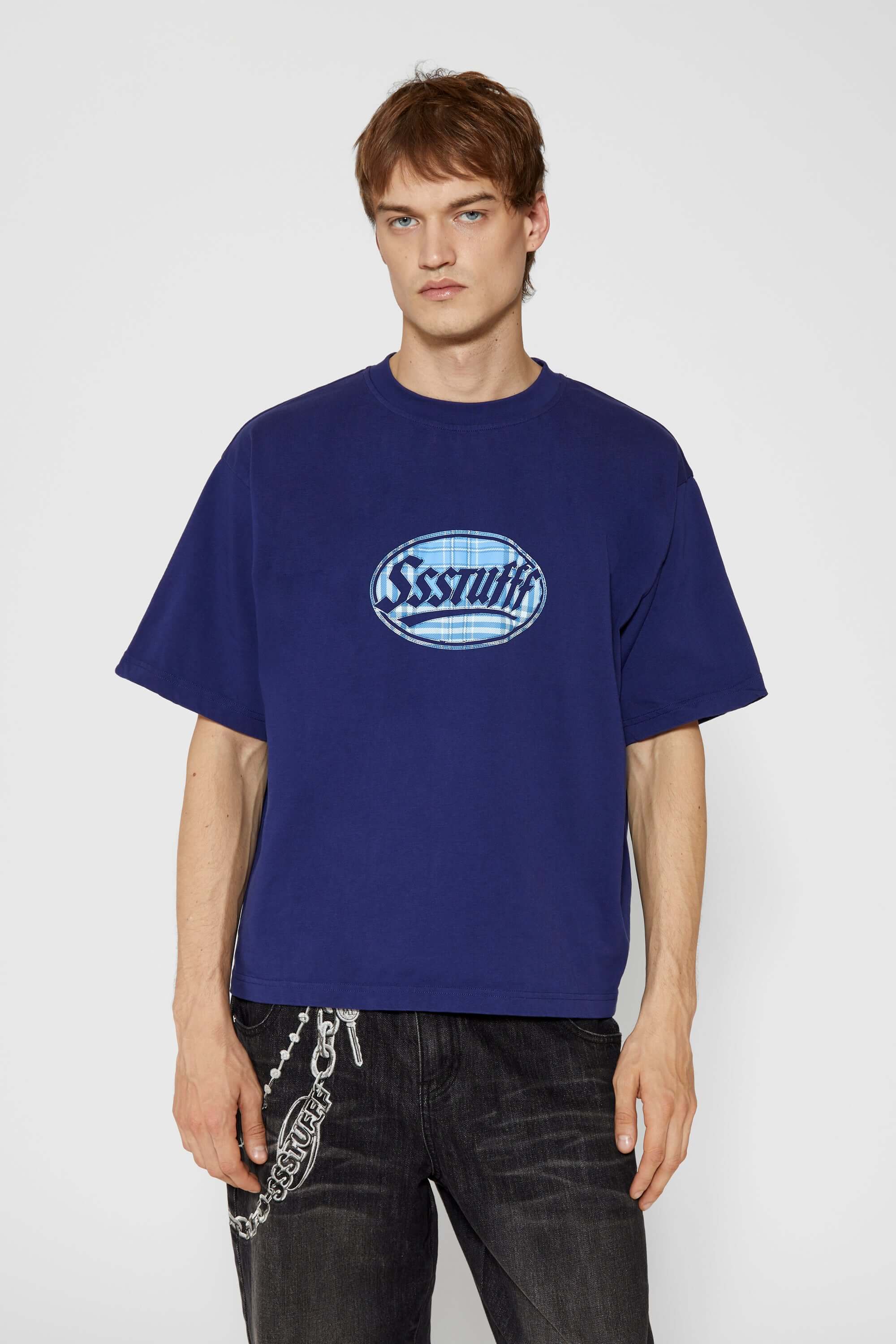 Navy t-shirt with check patchwork and puff-printed details that mimic stitching