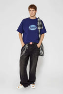 Navy t-shirt with check patchwork and puff-printed details that mimic stitching