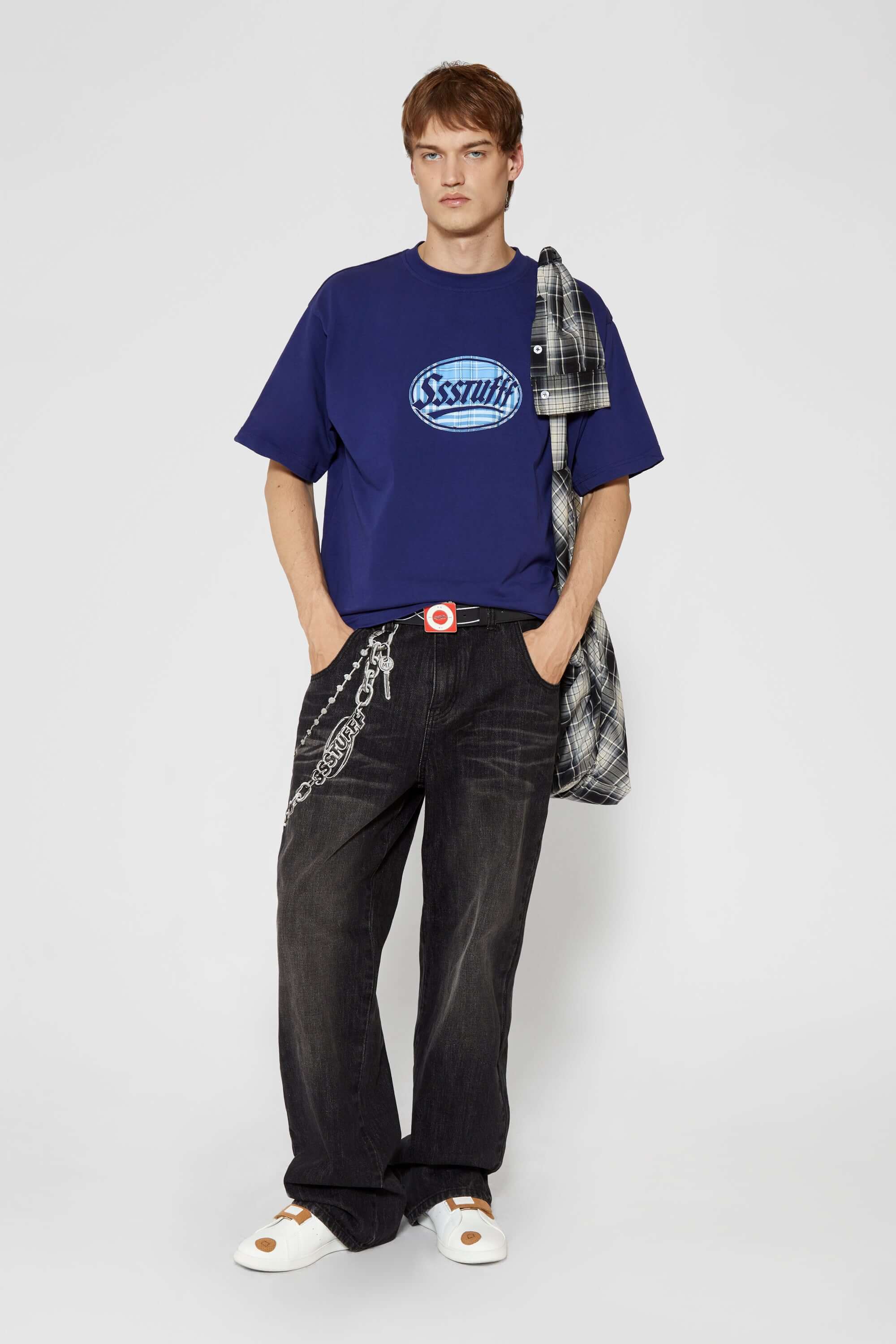 Navy t-shirt with check patchwork and puff-printed details that mimic stitching