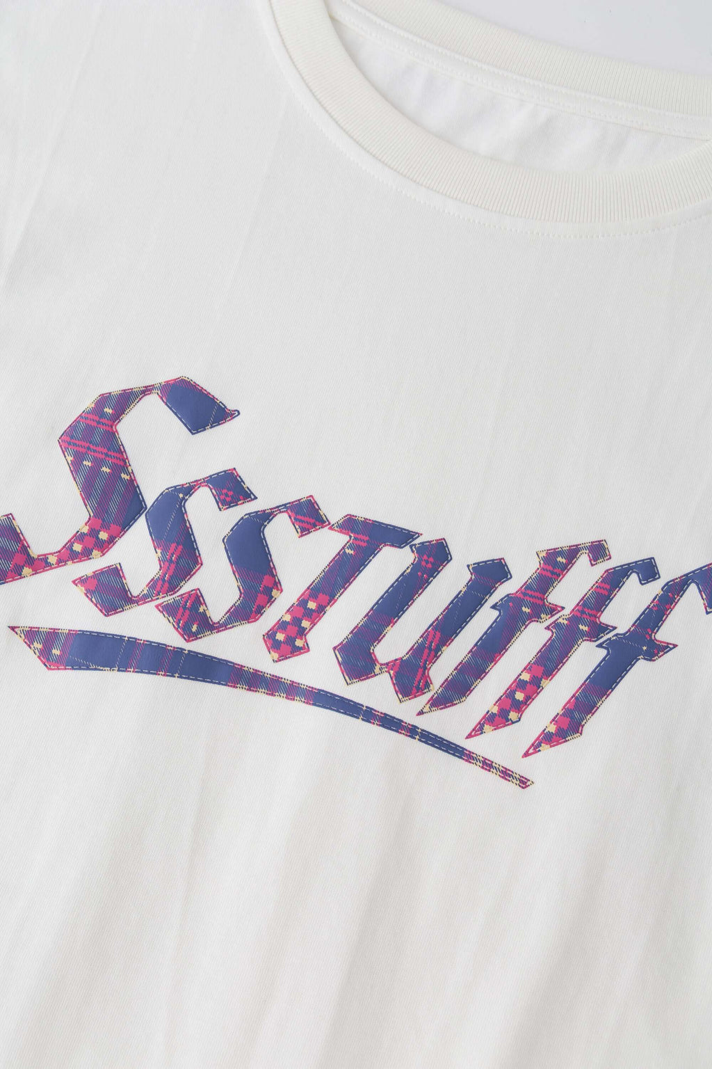 White t-shirt with check patchwork and puff-printed details that mimic stitching