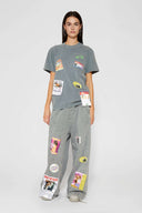 Hand-sewn grey t-shirt with Spanish telephone booth design featuring screen print, silicone print, jacquards, and vinyl details